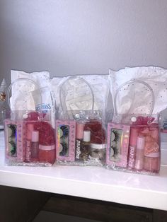 three bags filled with different types of items on a counter next to a clock and christmas tree