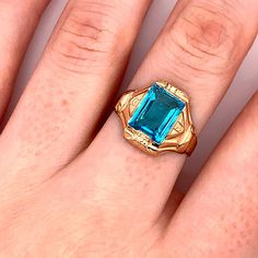 Vintage 1940's 10k yellow gold blue rectangular stone ring. The height of the ring off of the finger is 4.1mm. The width of the band is 3.9mm, and tapers down to 2.7mm. There are 4 rings available in size 7, 8, and 9.5, and they have the ability to be resized. Rectangular 14k Gold Birthstone Rings, 14k Gold Rectangular Birthstone Rings, Vintage Blue Gemstone Signet Ring, Vintage Blue Emerald-cut Topaz Ring, Classic 14k Gold Rectangular Topaz Ring, Vintage Rectangular Topaz Ring For Anniversary, Vintage Blue Topaz Ring In 14k Gold, Classic Rectangular Topaz Ring In 14k Gold, Vintage Gold Rectangular Emerald Ring