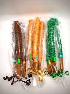 four different types of toothbrushes wrapped in plastic