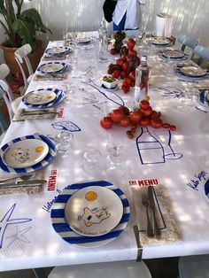 a table set with plates, silverware and utensils