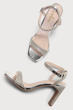 Every fashionable cutie needs a pair of the Lulus Kaylena Silver Rhinestone Ankle Strap High Heel Sandals! A sparkling silver rhinestone construction shapes these party-ready heels that feature a square toe bed with a dainty toe strap. A wrapped blade heel rises to a chic matching ankle strap that wraps around and secures with a shiny silver buckle. 3. 25" wrapped blade heel. Cushioned insole. Rubber sole has nonskid markings. Man Made Materials. Imported. Lulus | Kaylena Silver Rhinestone Ankle Chic Sparkling Sandals For Prom, Block Heel Sandals With Rhinestones For Prom, Rhinestone Block Heel Sandals For Prom, Prom Sandals With Rhinestones And Block Heel, Glamorous Sparkling Open Heel Sandals, Silver Round Toe Sandals For Prom, Glamorous Sparkling Ankle Strap Sandals, Elegant Ankle Strap Sandals With Bling, Glamorous Sparkling Sandals For Prom