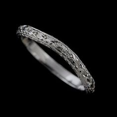 an antique style wedding ring in white gold