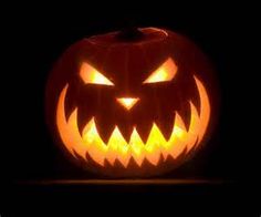 a jack o lantern pumpkin with the words happy halloween on it's face in front of a black background