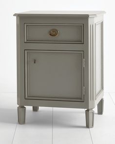 a small gray cabinet with two drawers on one side and an open drawer on the other