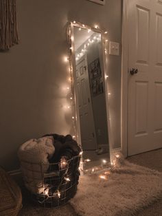 a room with lights on the wall and a mirror in the corner next to it