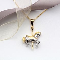 Magical and enchanting this wonderful Sterling Silver Carousel necklace is guaranteed to be jewellery to treasure. Enhanced by 18ct Gold Vermeil this necklace is popular with horse and non-horse lovers everywhere. Matching earrings available. Also available in 18ct Rose Gold Vermeil. Dimensions:  Height: 23mm Width: 19mm. Materials: 925 Sterling Silver and 18ct Gold Vermeil Gold Horse Design Pendant Necklace, Gold Pendant Necklace With Horse Design, Formal Horse Design Pendant Jewelry, Horse Design Round Pendant Necklace As Gift, Horse Design Round Pendant Necklace For Gift, Round Pendant Necklace With Horse Design For Gift, Carousel Necklace, Horse Carousel, Pig Necklace