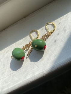 Handmade polymer clay and brass finish dangle earrings  Olive you  🫒❤️ Dangle Polymer Clay Single Earring, Dangle Single Earring Made Of Polymer Clay, Dangle Earrings With Polymer Clay And Ear Wire, Dangle Earrings With Ear Wire In Polymer Clay, Polymer Clay Dangle Earrings With Ear Wire, Green Lever Back Earrings As A Gift, Unique Dangle Polymer Clay Earrings, Green Brass Earrings As Gift, Green Brass Earrings For Gift