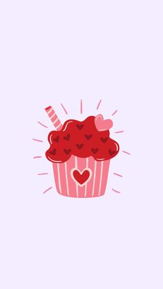 a pink cupcake with hearts on it