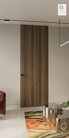 a modern living room with an area rug and leather chair in front of the door