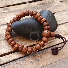 Introducing our exquisite Natural Aged Brown 5 Mukhi Rudraksha Buddhist Bracelet, a harmonious fusion of spiritual significance and timeless elegance. Handcrafted with care, each Rudraksha bead is meticulously sanded in a tumbler, ensuring unparalleled comfort against your skin. The beads are then naturally stained and delicately oiled, revealing a stunning and rich brown hue that accentuates the inherent beauty of these sacred seeds. Our artisans skillfully incorporate an adjustable knot into the design, allowing you to personalize the fit for optimal comfort. The bracelet not only serves as a meaningful accessory but also carries the essence of tradition and mindfulness. 📏Beads Size : 8-8.5 MM  📏Bracelet length: 7.0-7.25 Inches - Adjustable to 2.0 inches The 5 Mukhi Rudraksha beads hol Adjustable Traditional Bracelets For Rituals, Spiritual Brown Bracelet For Rituals, Traditional Hand Wrapped Brown Bracelet, Adjustable Bracelets For Meditation And Festivals, Adjustable Spiritual Bracelets For Festivals, Traditional Adjustable Bracelet With 8mm Beads, Bohemian Beaded Bracelets For Puja, Traditional Brown Bracelet For Rituals, Adjustable Spiritual Bracelets For Rituals