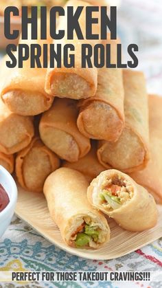 chicken spring rolls on a plate with dipping sauce