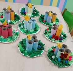 a table topped with paper plates filled with cakes