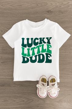 Lucky Little Dude Short Sleeve Top - Sparkle in Pink Trendy Green Top With Funny Print, Casual Green T-shirt For St. Patrick's Day, Cotton Top With Letter Print For St. Patrick's Day, Green Relaxed Fit T-shirt With Name Print, Green Relaxed Fit Top With Name Print, Green Relaxed Fit Top With Lettering, Green Top With Lettering And Relaxed Fit, Trendy Green Slogan Top, Green Top With Lettering In Relaxed Fit