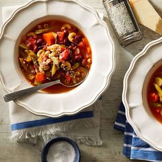 two bowls of soup on top of a table