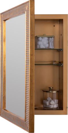 an open medicine cabinet with shelves and mirror on the front, next to it is a container filled with toilet paper