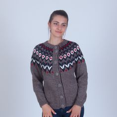 "Warm winter button up cardigan made of soft alpaca and merino wool blend. Completely hand knit in a traditional icelandic / nordic pattern. Composition - 30% alpaca wool, 30% merino wool, 40% acryl. ♡ Sizing ♡ You can find a size chart in the listing images. Alternatively, you can choose the \"Custom\" size if you want me to knit the item according to your measurements. The model in the images wears size M and has the following measurements: * height - 177 cm / 5 feet 10 inches * bust - 92 cm / Winter Merino Wool Sweater With Buttons, Nordic Winter Knitted Cardigan, Nordic Style Winter Cardigan For Cold Weather, Nordic Style Long Sleeve Knitted Cardigan, Nordic Wool Hand Knitted Outerwear, Winter Fair Isle Merino Wool Outerwear, Scandinavian Style Fair Isle Cardigan For Fall, Wool Nordic Style Cardigan, Scandinavian Style Long Sleeve Cardigan With Fair Isle Pattern