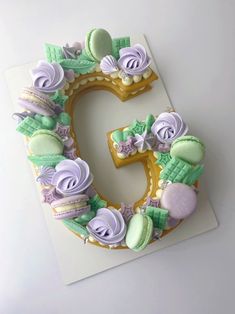 the letter c is made out of cookies and icing