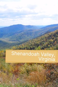 there is a sign that says shenandoah valley, virginia in front of the mountains