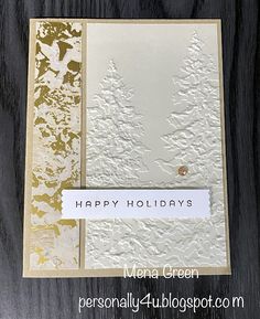 a white and gold holiday card with the words happy holidays on it