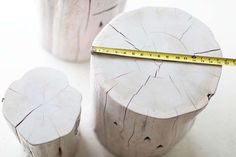 there are two pieces of wood that have been cut in half with a tape measure