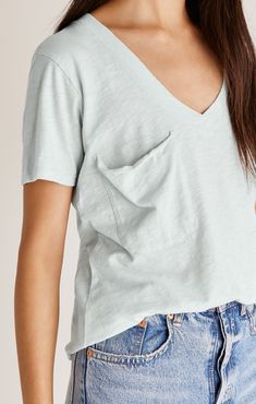 The Cotton Slub Pocket Tee represents one of our best-selling silhouettes. This tee features a soft feel, v-neckline, slouchy pocket with raw edge, curved shirttail hem, and that relaxed fit. Fabric Content: 100% Cotton Everyday V-neck Tops With Pockets, Casual V-neck Tops With Side Pockets, Soft Edges, Closet Essentials, Pocket Tshirt, Style Gift, Staple Pieces, Pocket Tee, Raw Edge