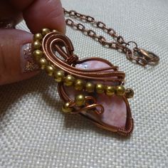 Stunning Rhodochrosite Handmade Copper Wire-Wrapped With Gold Beads Pendant On A 18" Chain (2 1/4" X 1 1/8" Pendant) #170c All Of My Jewelry Is Handmade By Me In My Smoke & Pet Free Home!!!!!! Please Note That Every Item Purchased Comes In A Drawstring Organza Bag For Easy Gift Giving!!! Please Note That I Will Consider Any Reasonable Offer On My Jewelry!!!!!!!!!! Please Let Me Know If You Have Any Further Questions. Thanks For Stopping By And Have A Terrific Day!!!! Pink Wire Wrapped Copper Wire Jewelry, Pink Copper Wire Wrapped Jewelry, Handmade Artisan Pink Necklaces, Pink Copper Wire Jewelry For Gifts, Unique Hand Wrapped Pink Jewelry, Bohemian Hand Wrapped Pink Jewelry, Bohemian Pink Hand Wrapped Jewelry, Artisan Pink Necklaces For Gifts, Handmade Pink Copper Wire Jewelry