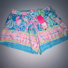 The Katia Short Is A 5 Inch Engineered Printed Pull On Short. These Shorts Have A Drawstring At The Waist And Slits On The Side Seam Openings. We Wear These Shorts From Morning To Night Time. 5" Inseam. Palm Beach Rayon (100% Rayon). Machine Wash Cold. Separately. Delicate Cycle. Garment Washed, Pull On Short With Drawstring On Waist And Slits On Side Seam Openings. Masterpiece Print. Pink High-waisted Pajama Shorts For Vacation, Multicolor Beachy Shorts, Cute Pajama Shorts For Beach Spring Season, Cute Spring Beach Pajama Shorts, Cute Beach Bottoms With Elastic Waistband, Cute Pajama Shorts With Elastic Waistband For Beach, Cute Green Beach Shorts, Cute Multicolor Beach Bottoms, Cute Bottoms With Built-in Shorts For Beach