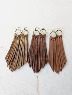 Long Fringe Leather Earrings- Leather Fringe Earring - Boho Earrings - Fringe Earrings - Tassel Earrings - Western Jewelry- Western Earrings - Gift This listing is for a handmade Genuine Leather Fringe Earrings with nickel free ear wires. Colors: Caramel Matte, Caramel pecan and brown chocolate soft shiny genuine leather * Leather measures approx 4 inches, with hook and circle charm approx 5 inches All earrings are handmade by yours truly! I have multiple sizes, shapes, patterns and colors available! Special requests are always welcome! I currently have multiple hooks available, if you have a preference of color or style, please don't hesitate to leave me a request in the "note to seller" box at checkout! Thank you for browsing my shop Shipping - Your item will be packaged with care and sh Brown Fringed Tassel Earrings Gift, Brown Fringe Tassel Earrings As Gift, Brown Fringe Tassel Earrings For Gift, Bohemian Brown Fringe Earrings, Adjustable Brown Bohemian Tassel Earrings, Brown Dangle Earrings With Tassels, Bohemian Brown Beaded Tassel Earrings, Brown Fringe Tassel Dangle Earrings, Brown Fringe Dangle Tassel Earrings