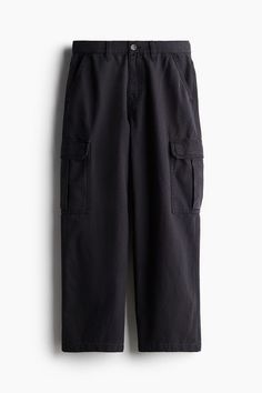 Baggy-fit cargo pants in thick cotton canvas with a casual  but not oversized silhouette. Zip fly with button  side pockets  back pockets  and bellows leg pockets with flap and snap fasteners. Wide-leg Work Pants With Cargo Pockets For Streetwear, Relaxed Fit Wide-leg Utility Cargo Pants, Casual Wide-leg Pants With Flap Pockets, Utility Wide-leg Cargo Pants With Hip Pockets, Urban Cotton Parachute Pants With Flap Pockets, Cotton Parachute Pants With Flap Pockets For Streetwear, Baggy Cargo Jeans For Work, Baggy Cotton Cargo Pants With Patch Pockets, Utility Wide-leg Cargo Pants