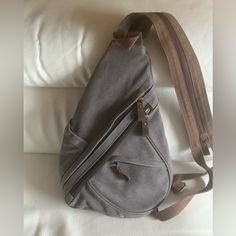 Unisex M/W Canvas Backpack/Shoulder Bag ,Nice Gray Color ,Very Comfortable For Using. L9.5”. Never Used Large Capacity Gray Chest Bag For Outdoor, Outdoor Large Capacity Gray Chest Bag, Gray Travel Chest Bag With Zipper Pocket, Gray Canvas Bag With Adjustable Strap For Daily Use, Gray Shoulder Bag With Zipper For School, Gray Chest Bag With Zipper Pocket For Daily Use, Daily Use Gray Chest Bag With Zipper Pocket, Gray Everyday Shoulder Bag, Gray Zipper Closure Shoulder Bag For School