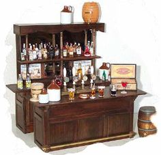 an old fashioned bar with bottles and glasses on it