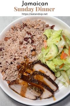 a white plate topped with meat, rice and salad