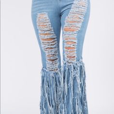 Features: I'll Crazy Distressed Light Denim Pants With Fringes On The Sides Giving You That Nice Curvy Fit Fabric & Care: 100% Polyester Wash In Cold Water Tumble Dry Or Hang Dry Casual High-waist Jeans With Fringe, Trendy High Waist Fringe Jeans, Trendy Straight Leg Bottoms With Fringe, Spring High Rise Fringe Jeans, Spring Wide Leg Bottoms With Fringe, Trendy Denim Bottoms With Fringe, Trendy Denim Blue Bottoms With Fringe, Fitted Denim Bottoms With Fringe, Spring Fringe Denim Blue Jeans