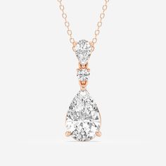 A celebration of smooth curves and sharp edges, this hinged pear shape diamond pendant radiates with effortless elegance. A solitaire lab grown pear shaped diamond creates a beautiful reflection against a smaller pear shaped and round diamond, promoting the elongating effect of this refined shape. Style this pendant on its own for a subtle sparkle or make it the most beautiful part of your layered look. Luxury Drop-shaped Solitaire Necklace As Gift, Pear-shaped Diamond Necklace, Pear-shaped Diamond Cut Necklace For Formal Occasions, Elegant Pear-shaped Drop Necklace For Formal Occasions, Pear-shaped Cubic Zirconia Diamond Necklace For Formal Occasions, Pear-shaped Yellow Gold Diamond Necklace, Formal Pear-shaped Cubic Zirconia Diamond Necklace, Classic Yellow Gold Pear Shaped Diamond Necklace, Timeless Teardrop Drop Necklace For Formal Occasions