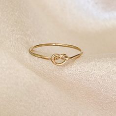 Tie The Knot Ring - Gold Knot Ring - Bridesmaids Gift - 14k Gold Filled Knot Ring - Minimalist Gold Stacking Ring - Hypoallergenic Handcrafted * Hypoallergenic * Waterproof * Tarnish Resistant.  This little ring makes a great promise ring or bridesmaid gift! 14k gold filled knot ring. Waterproof and made to last.  14k gold filled is great for sensitive skin and is tarnish resistant. Gold Knot Ring, Locket Design, Gold Stacking Ring, Love Knot Ring, Ringe Gold, Golden Ring, Twist Knot, Tie The Knot, Knot Ring