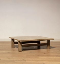 a wooden table sitting on top of a hard wood floor