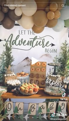 a dessert table filled with donuts and pastries