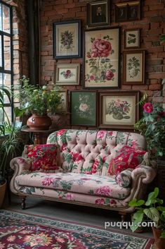 a living room filled with furniture and lots of pictures on the wall above it's windows