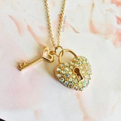 Gold Tone Opalescent Rhinestone Heart Lock & Key  Pendant Necklace Love / Luck  Friendship Jewelry  18 Inch Gold Plated Chain  Lobster Clasp Closure Comes in Gift Box and Organza Gift Bag Ships within 3 days. Will ship first class mail.  See our shop Hello Emiko for more beautiful handmade jewelry and gifts. Key Pendant Necklace, Necklace Love, Heart Lock, Daisy Necklace, Friendship Jewelry, Gold Charm Necklace, Sapphire Pendant, Rhinestone Heart, Cat Jewelry