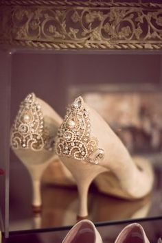 wedding shoes in front of a mirror