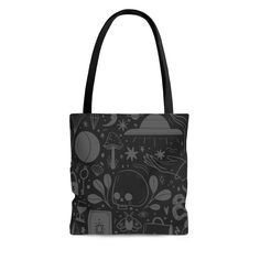 a black and white tote bag with an image of space related items on it