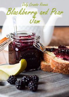 blackberry and pear jam in a jar next to sliced bread