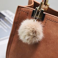 The perfect way to complete any look! Crafted with premium imitation suede, this bag is both stylish and durable. DESIGN – Effortless style and quality, use it with casual wear or dress it up. FEATURES – Attractive and strong strap connector, finished with straight stitching, includes a fluffy pompom charm. Four fashion colours available. Bag measurements: 23 cm (height) x 24 cm (width) x 15 cm (depth). MATERIAL – High quality PU Leather. Chic Beige Suede Shoulder Bag, Chic Beige Suede Bag, Chic Suede Bag With Zipper Closure, Casual Tote Bag, Soft Bag, Genuine Leather Totes, Handbag Women, Genuine Leather Wallets, Women Bags Fashion