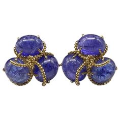 Verdura Polished Stone Tanzanite & 18k Rope Gold Clip On Earrings. Verdura Tanzanite & 18k Gold Earrings Clip On Style - 1 1/4”. Polished stones in rope like gold pattern - described by Verdura as "beautiful polished pebbles, fished from the bottom of the sea and caught in a net of gold.” Retails for $34,500. *Please note: there is a very tiny imperfection on one of the stones on one of the earrings. Wether it is the natural characteristic of the tanzanite or damaged is unknown. It’s approx 1mm Formal Oval Tanzanite Earrings, Exquisite Cabochon Earrings For Formal Occasions, Luxury Tanzanite Earrings, Exquisite Formal Cabochon Earrings, Tanzanite Gemstone Earrings For Formal Occasions, Formal Tanzanite Gemstone Earrings, Formal Tanzanite Earrings In Fine Jewelry Style, Blue High Luster Earrings For Formal Occasions, Formal Blue High Luster Earrings