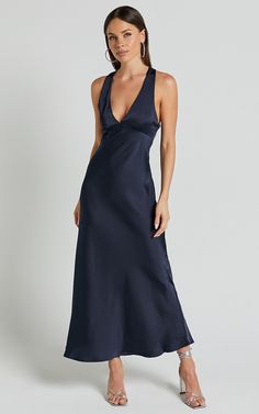 Get ready to turn heads in the Khalani Midi Dress. This stunning navy slip dress is perfect for any occasion, whether you're heading to a cocktail party or a formal event. The deep V-neckline adds a touch of glamour, while the satin fabric gives off an effortlessly chic vibe. Made from high-quality polyester, this dress is not only comfortable but also easy to care for. The midi length and sleeveless design make it versatile enough to wear year-round. Whether you're attending a wedding or standi 21st Guest Outfit, Bridesmaid Dresses V Neck, Navy Dresses Formal, Navy Dress Formal, V Neck Satin Dress, Slip Dress Cocktail, Spring Wedding Guest Outfit, Navy Slip Dress