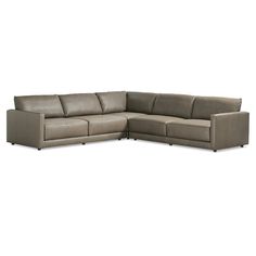 a large sectional couch sitting on top of a white floor