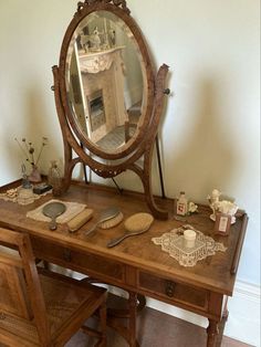 an antique dressing table with mirror and shaving tools