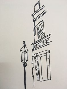 a black and white drawing of a street light next to a building with a clock on it