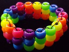 multicolored bracelet with beads on black background