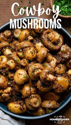 a blue bowl filled with mushrooms on top of a wooden table next to parsley